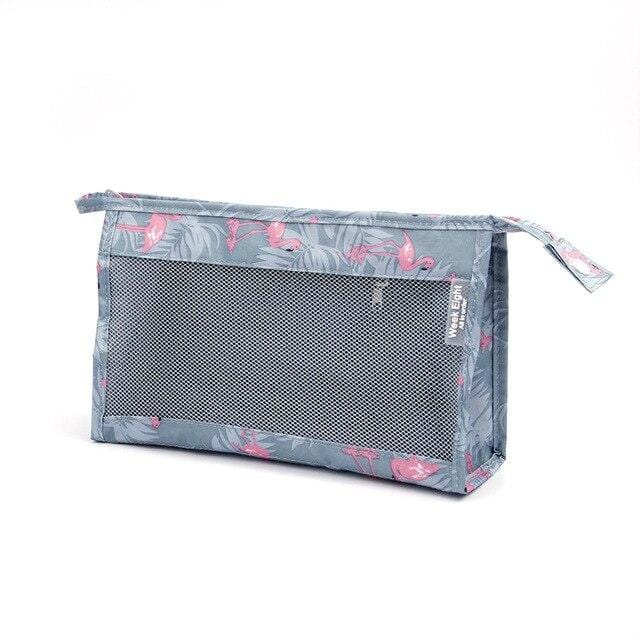 Trousse de toilette bleue et transparente pour voyage