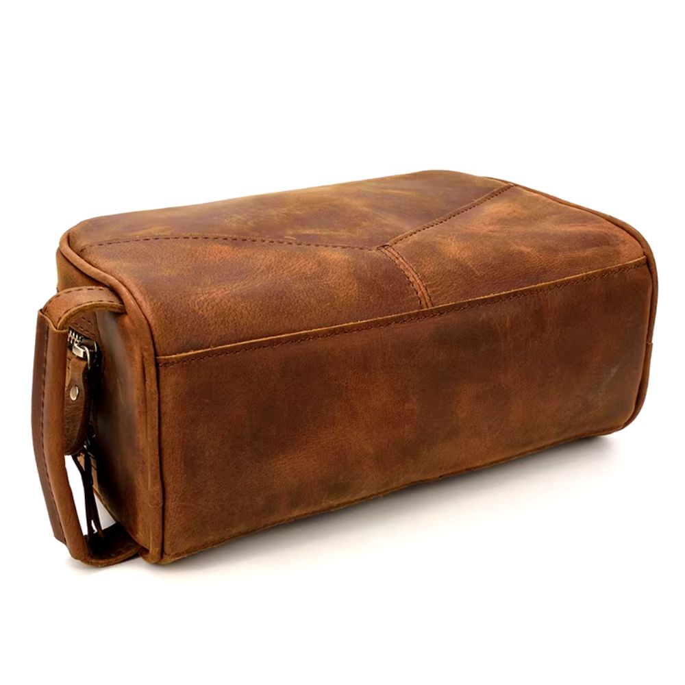 Trousse de toilette marron avec poignée en cuir